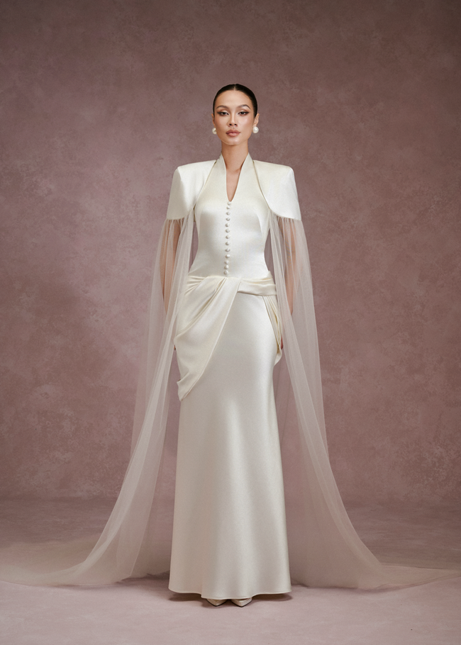 LARMES Ziva satin halter dress in ivory – front view, full length with shoulder cape