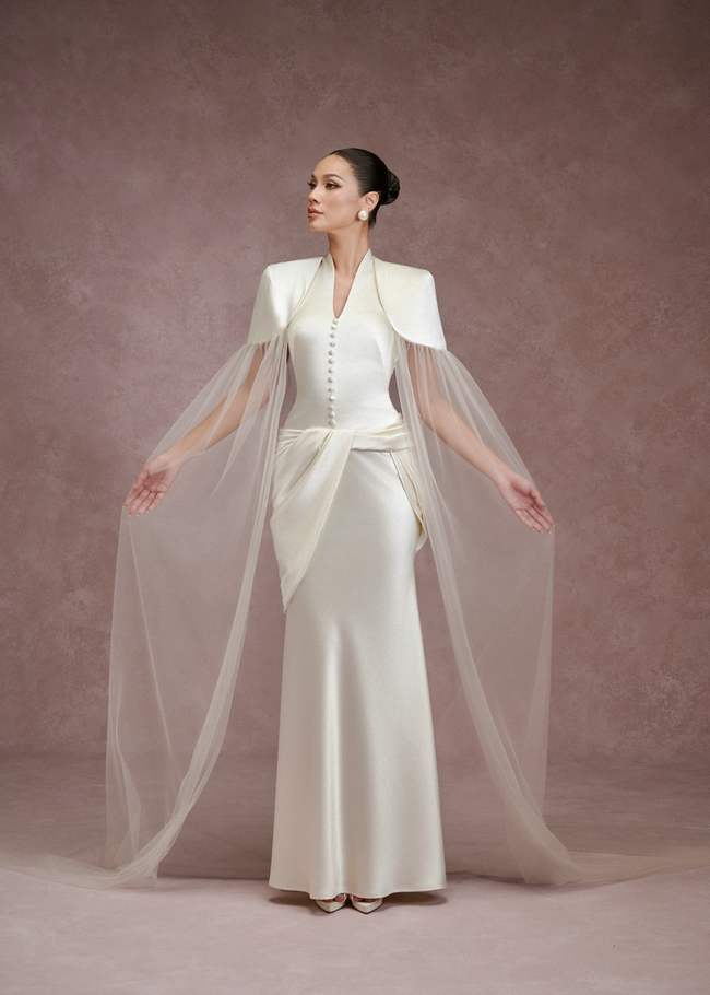 Ziva satin halter dress in ivory – front view, arms out, showing the sheer cape sleeves